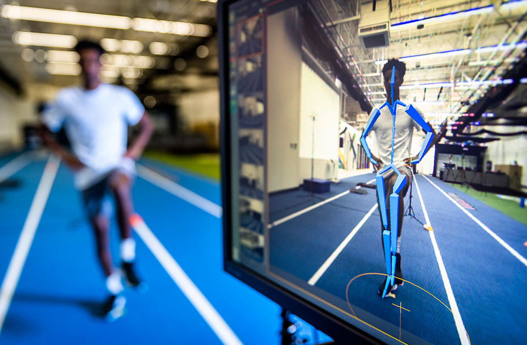 A monitor gathers biomechanic data on an athlete.