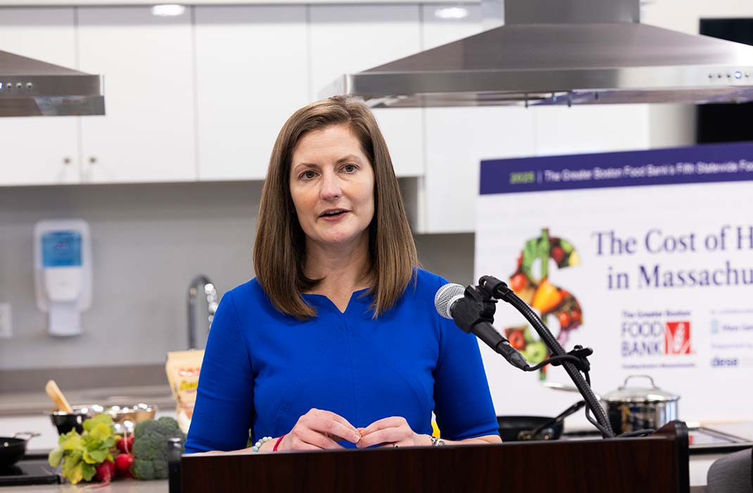 Dr. Lauren Fiechtner speaking at a food bank press event