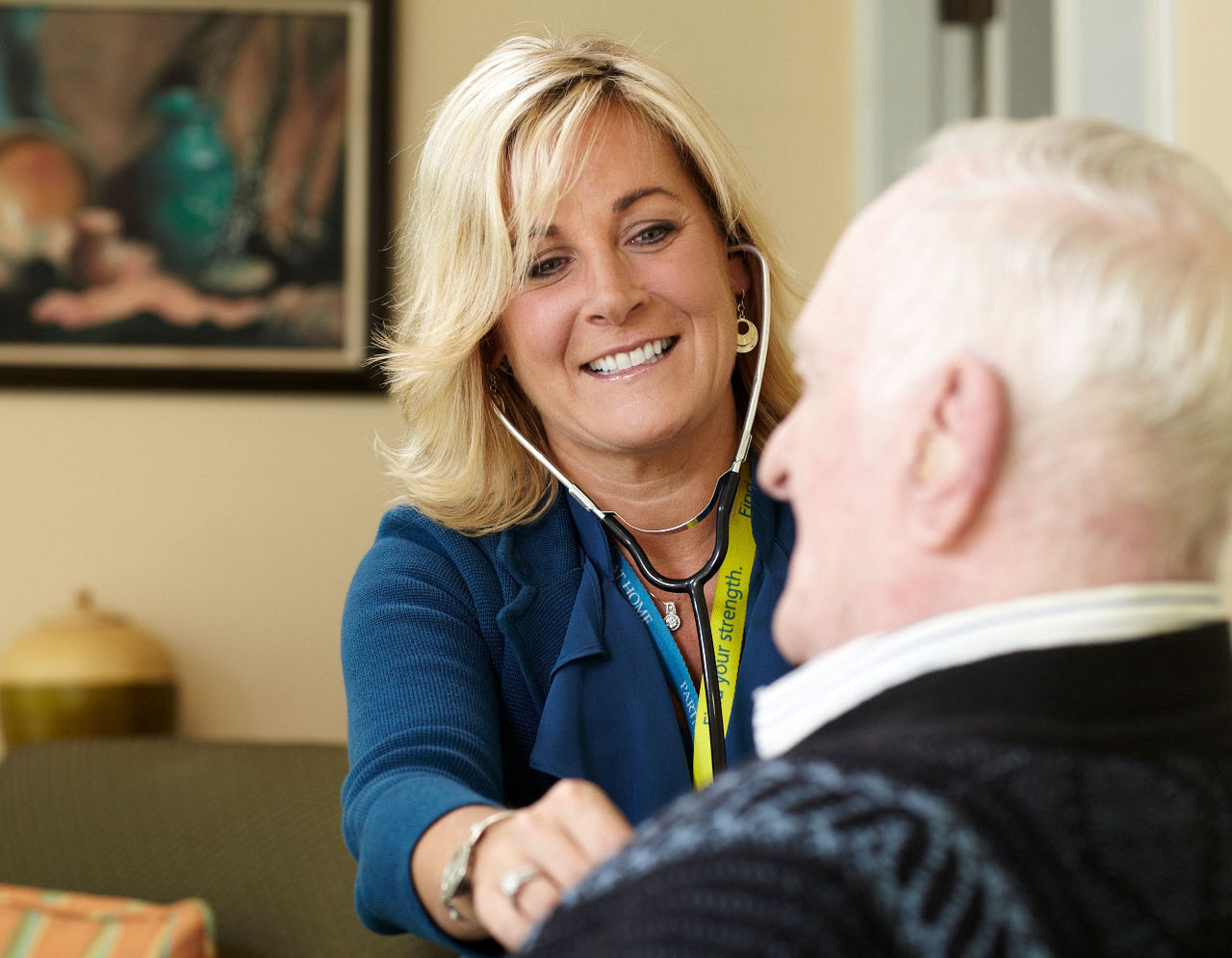 A health care provider examines a patient for Home Care