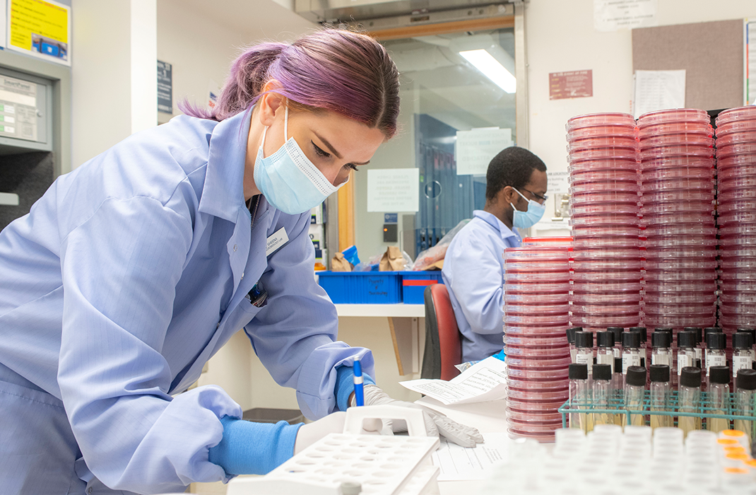 male and female researchers working in lab